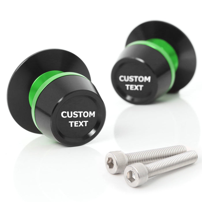 Customized engraved MC Motoparts S-Fight swingarm spools in 6mm, 8mm, or 10mm, featuring laser-engraved text on metal.