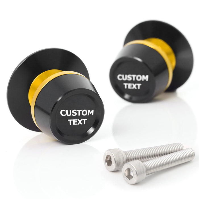 Customized engraved MC Motoparts swingarm spools with laser-engraved text for 6mm, 8mm, or 10mm bike swingarms, shown in the image.