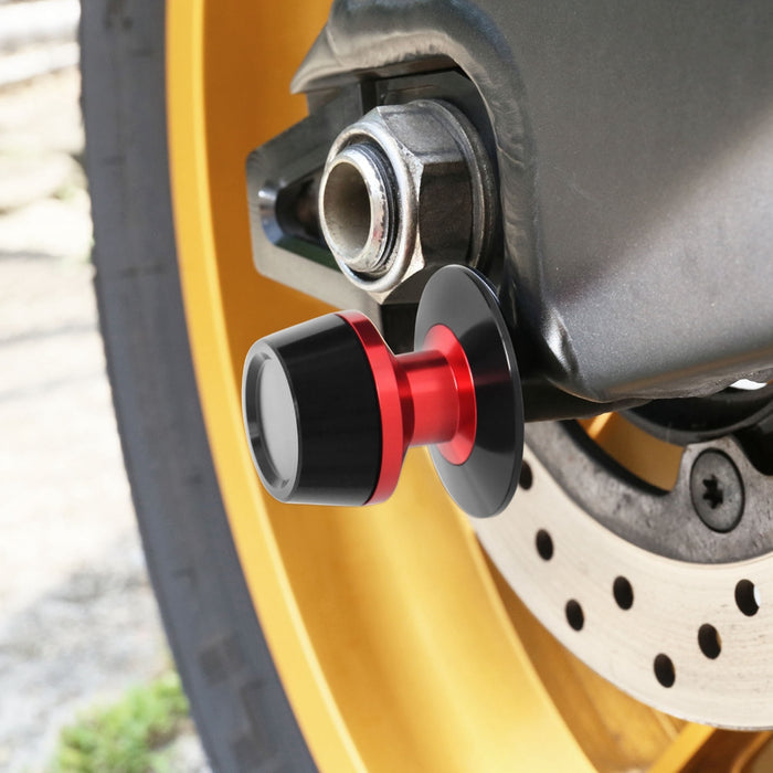 MC Motoparts Fit Aprilia Caponord 1200 Swingarm Spools with engraved logo for secure motorcycle wheel mounting.