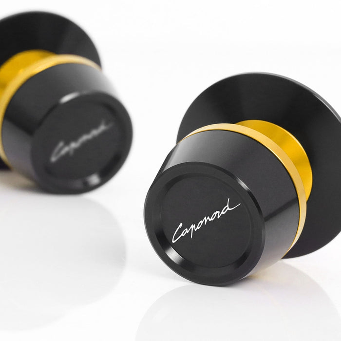 MC Motoparts Fit Aprilia Caponord 1200 swingarm spools with engraved logo, designed for secure motorcycle wheel removal.