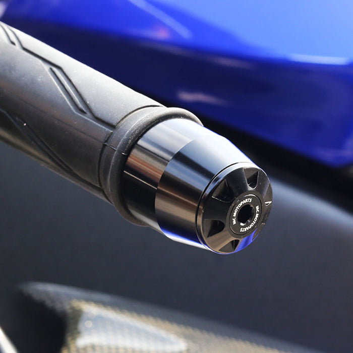Black CNC bar ends for Benelli TNT 1130, BN302, and Storm motorcycle handlebars, installed on MC Motoparts brand bike.