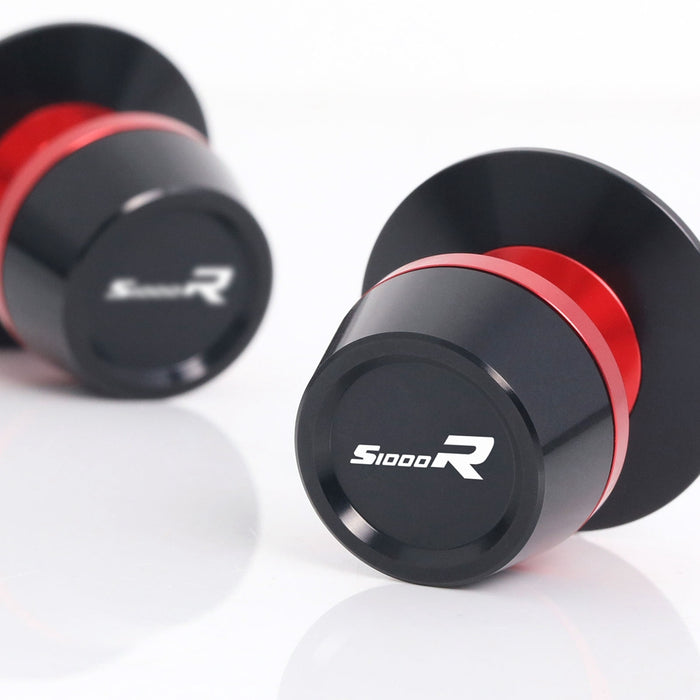 MC Motoparts BMW S1000R swingarm spools with engraved logo, 8mm threaded mounts for motorcycle track and maintenance use