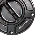 MC Motoparts Honda CBR1000RR Fireblade 2014-2021 keyless fuel tank cap with engraved logo, black finish, and secure locking mechanism.
