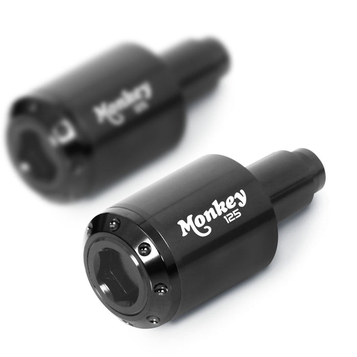 Engraved logo MC Motoparts Atom bar ends for Honda Monkey 125 2018-2024, black metal with cylindrical design.
