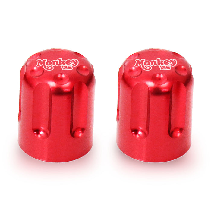 Honda Monkey 125 engraved logo tire valve stem caps by MC Motoparts, featuring a red color and detailed logo design.