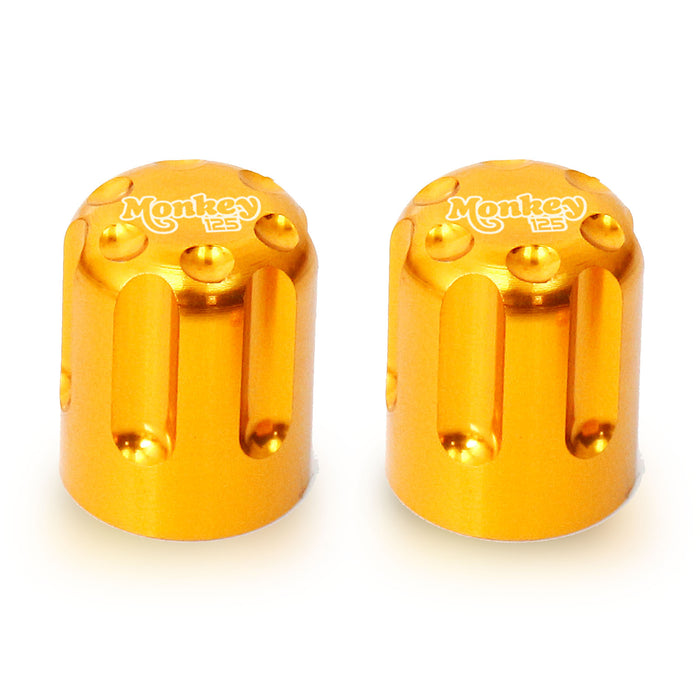 Honda Monkey 125 engraved logo tire valve stem caps by MC Motoparts, featuring detailed logo design on metal caps.