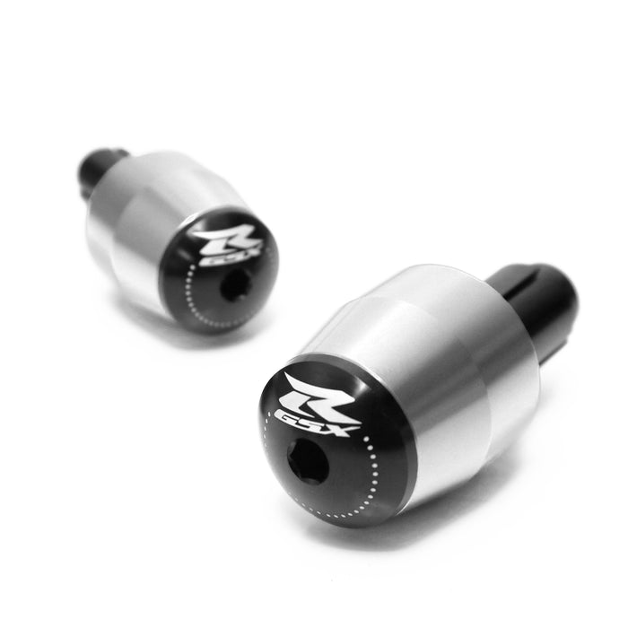 MC Motoparts engraved logo GSXR handlebar ends, black metal with detailed logo engraving, designed for Suzuki GSXR motorcycles.