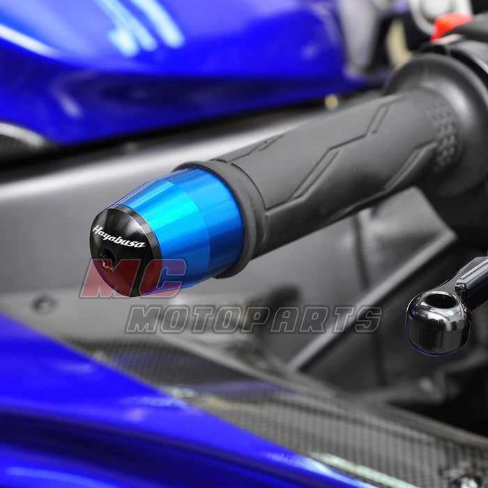 Suzuki Hayabusa engraved logo handlebar ends by MC Motoparts, metal bar ends with engraved branding, mounted on motorcycle handlebars.