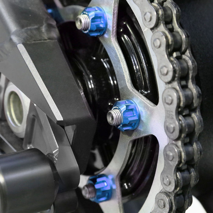 Set of six blue MC Motoparts Yamaha YZF R1 R6 R25 R1M R3 sprocket nuts for rear motorcycle sprockets.