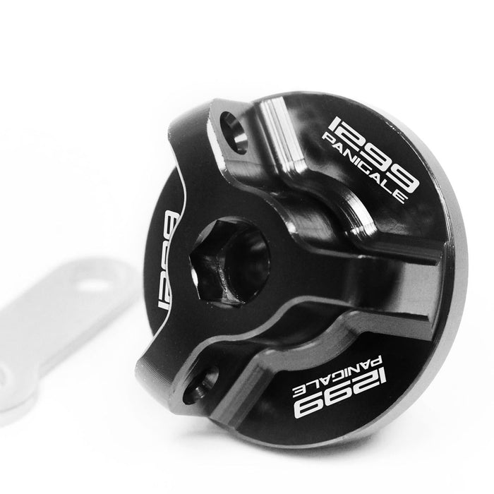 Black engraved oil filler cap for Ducati 1299 Panigale S 2015-2019, made by MC Motoparts, with logo detail.
