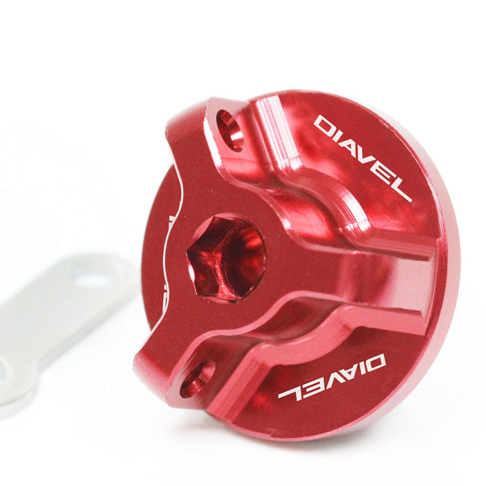 MC Motoparts engraved oil filler cap with Ducati Diavel Carbon logo, designed for 2010-2017 models, shown on motorcycle engine.