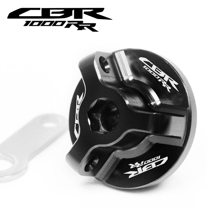 Black Honda CBR1000RR oil filler cap with engraved MC Motoparts logo, fits 2004-2023 model, made of durable metal.