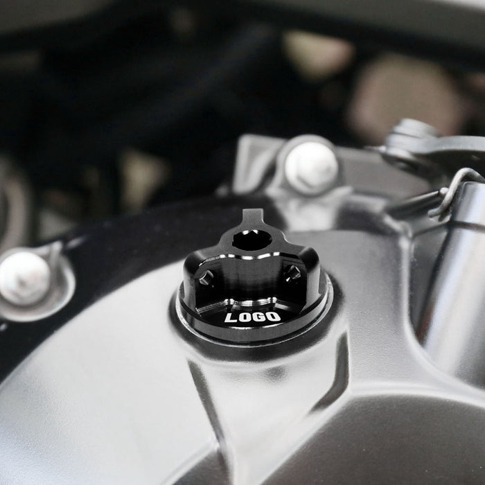 Black engraved Honda CBR1000RR oil filler cap with MC Motoparts logo, designed for models 2004-2023, featuring a secure fit and stylish design.