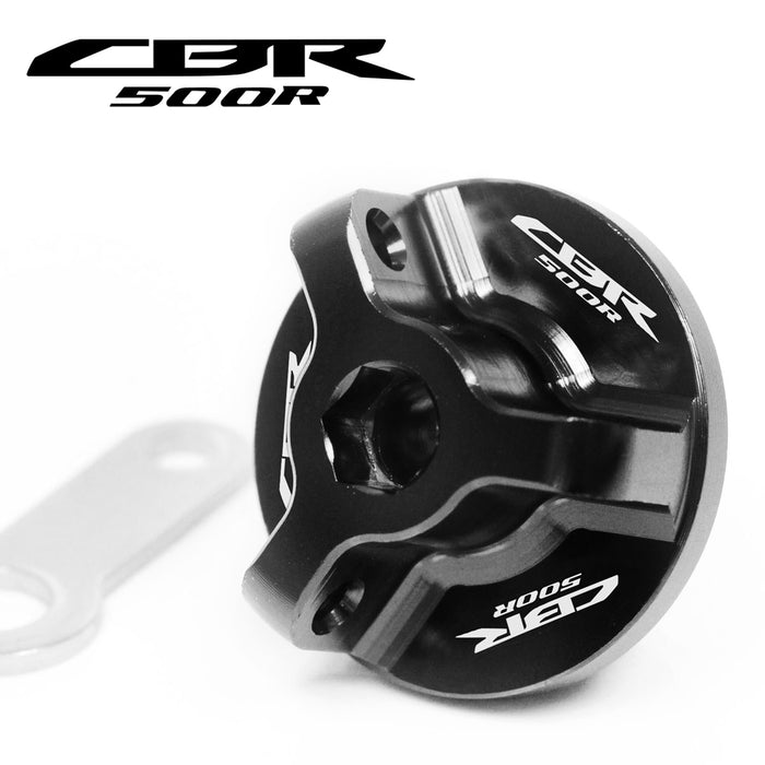 Black engraved oil filler cap for Honda CBR500R (2013-2025) by MC Motoparts, featuring logo design and durable metal construction.
