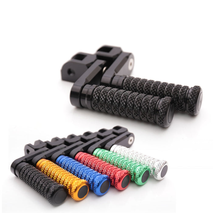 Black MC Motoparts 40mm extension foot pegs for Aprilia Tuono 125, 660, 1000 V4R models, shown installed on motorcycle front.