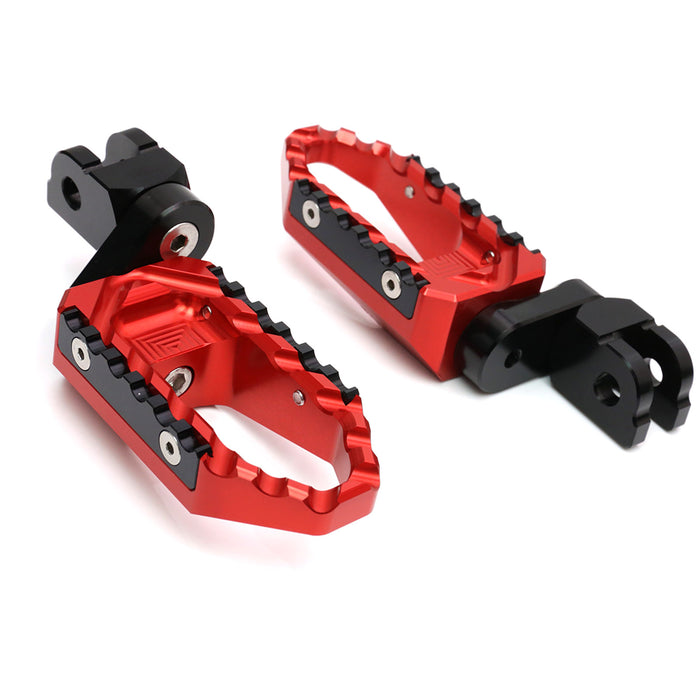 Black 25mm extension foot pegs for BMW R nineT and K1300R, designed by MC Motoparts, with a wide touring style for rider comfort.