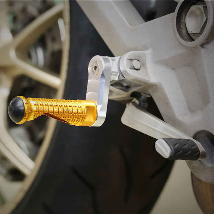 MC Motoparts 40mm extension front foot pegs installed on BMW R nineT Scrambler, S1000RR, K1200R motorcycle for lower riding position.