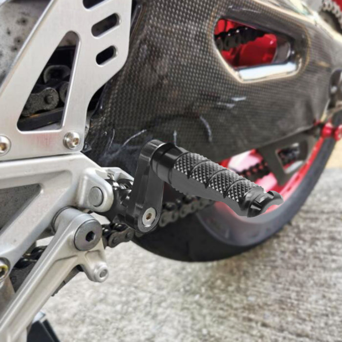 Front view of MC Motoparts 40mm extension foot pegs for BMW S1000R S1000RR R1200GS R-FIGHT, showing installation details.