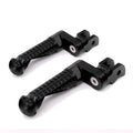 Black MC Motoparts 25mm extension foot pegs for BMW S1000RR, front view showing sturdy metal construction and secure mounting points.