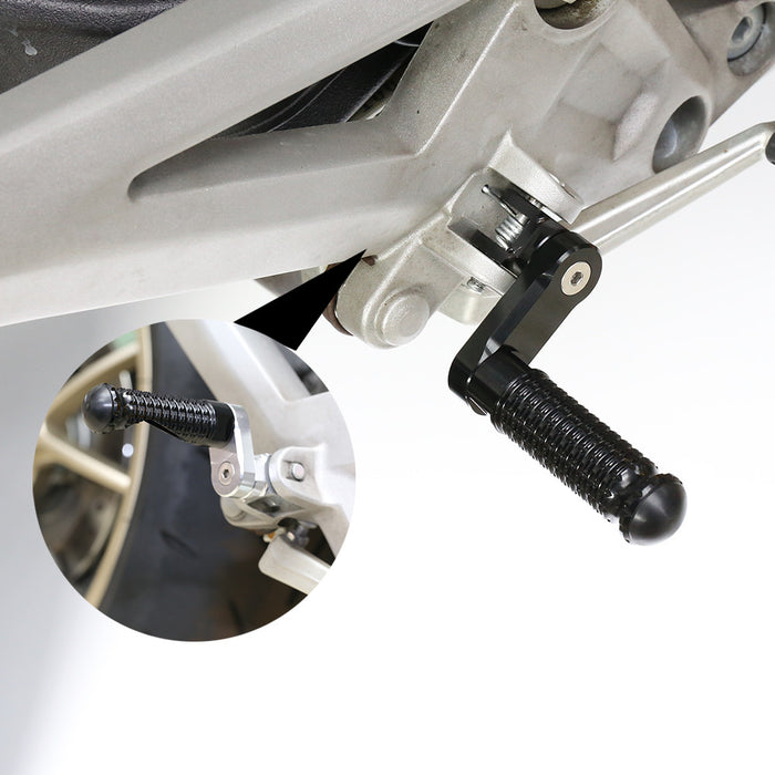 Black MC Motoparts 40mm extension foot pegs for Buell M2 S1 S3 X1, installed on the front motorcycle.