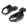 MC Motoparts 25mm extension foot pegs for Ducati Monster 821 and 1200 TRC touring, shown in black with extended design.