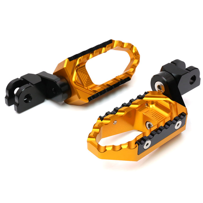 Black MC Motoparts 25mm extension foot pegs for Harley Davidson Fatboy TRC Touring, offering wider, comfortable foot placement.