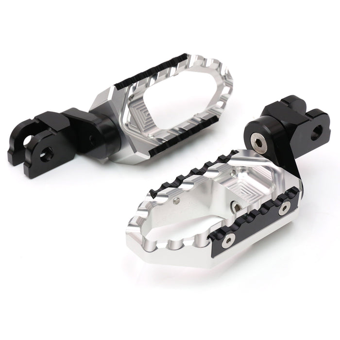 MC Motoparts 25mm extension foot pegs for Harley Davidson Fatboy TRC Touring, shown installed on motorcycle front.