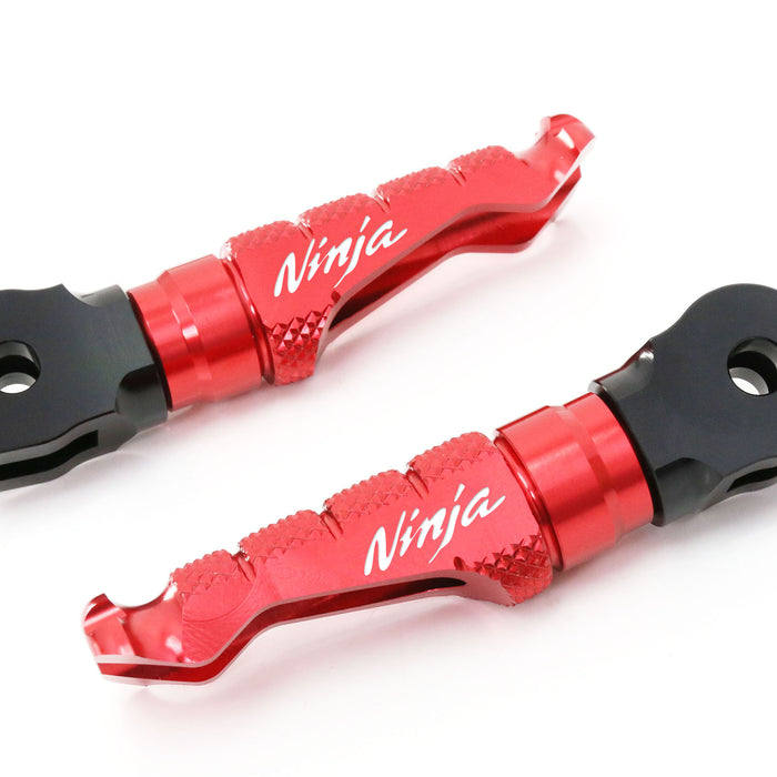 Kawasaki Ninja ZX-6R ZX-9R R-FIGHT engraved logo standard foot pegs by MC Motoparts, showing front view with detailed logo design.