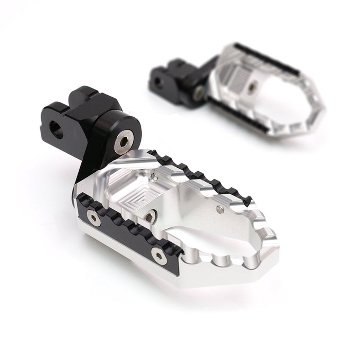 MC Motoparts 25mm extension foot pegs for Kawasaki Z H2, Z900, Z125, and TRC Touring bikes, mounted on the front.