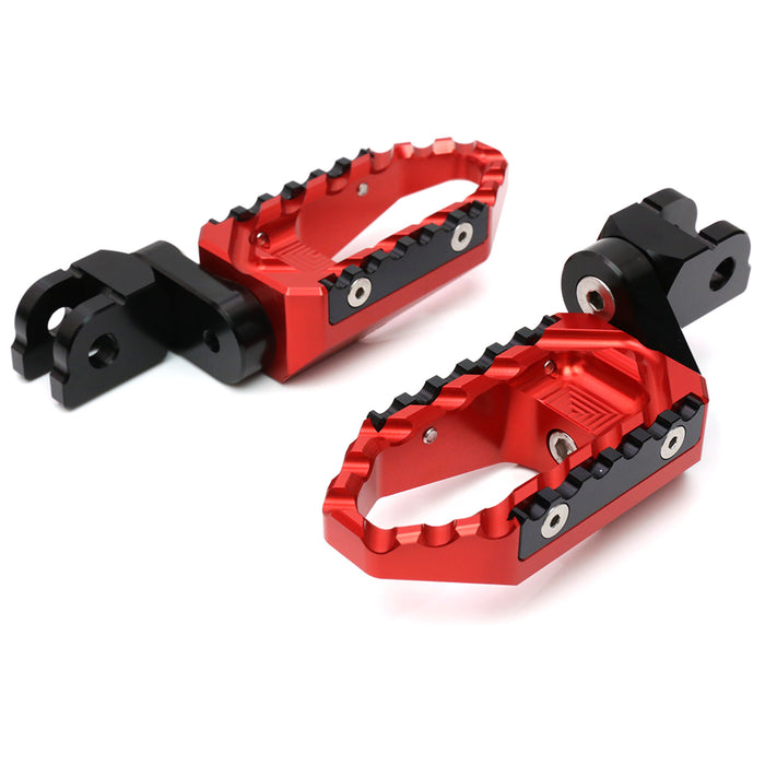 Black 25mm extension touring foot pegs for Kawasaki ZX10R and ZX6R, MC Motoparts. Front view showing multi-step design and sturdy build.
