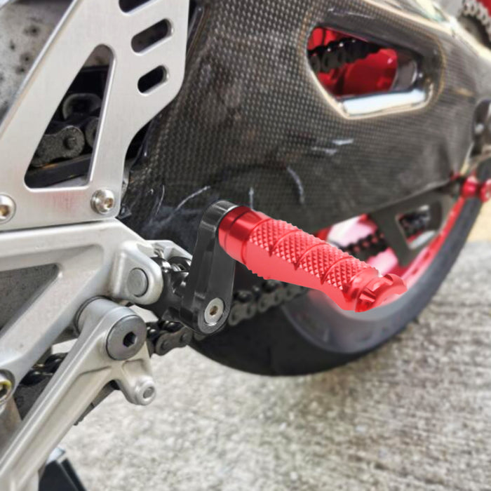 Front view of MC Motoparts 40mm extension foot pegs installed on Moto Guzzi V9 V7 V100 motorcycle.
