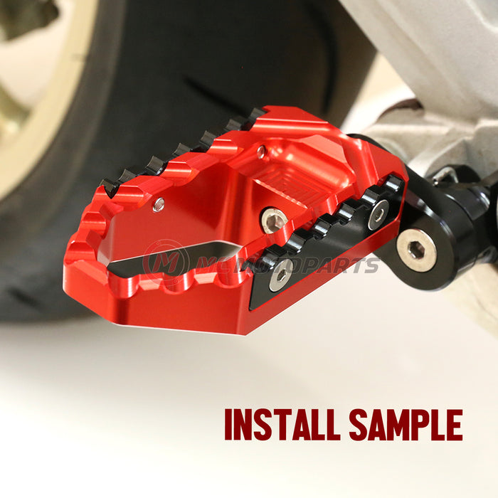 MC Motoparts 25mm adjustable wide foot pegs for Moto Guzzi V9 V7 V100 TRC touring models, shown installed on motorcycle.