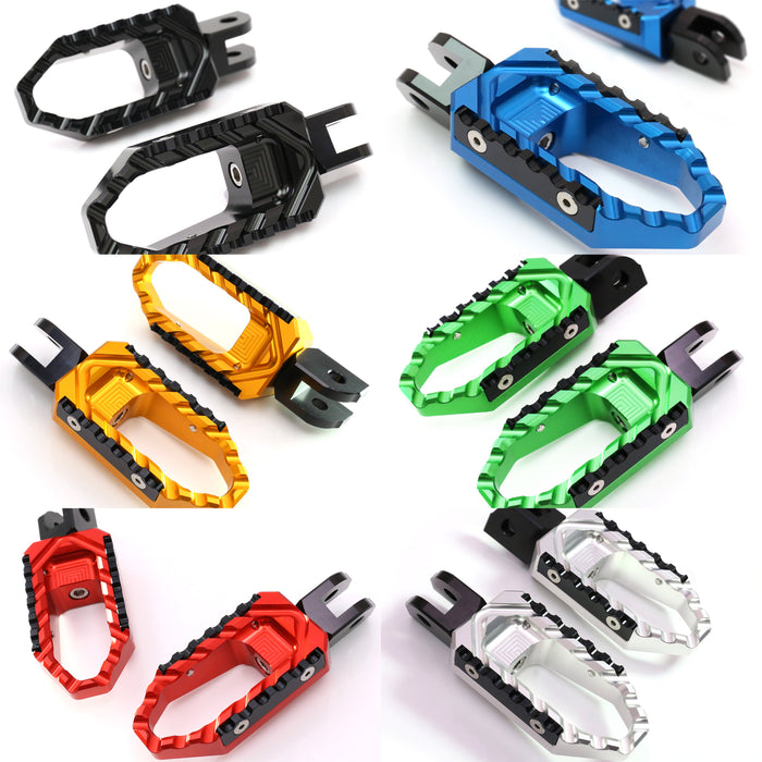 Black MC Motoparts touring wide foot pegs for Moto Guzzi V9, V7, and V100 TRC motorcycles, shown with mounting brackets.