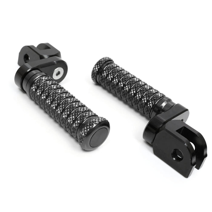 Black 25mm extension foot pegs for Triumph Scrambler 1200 and Trident 660, mounted on MC Motoparts lowering pole.