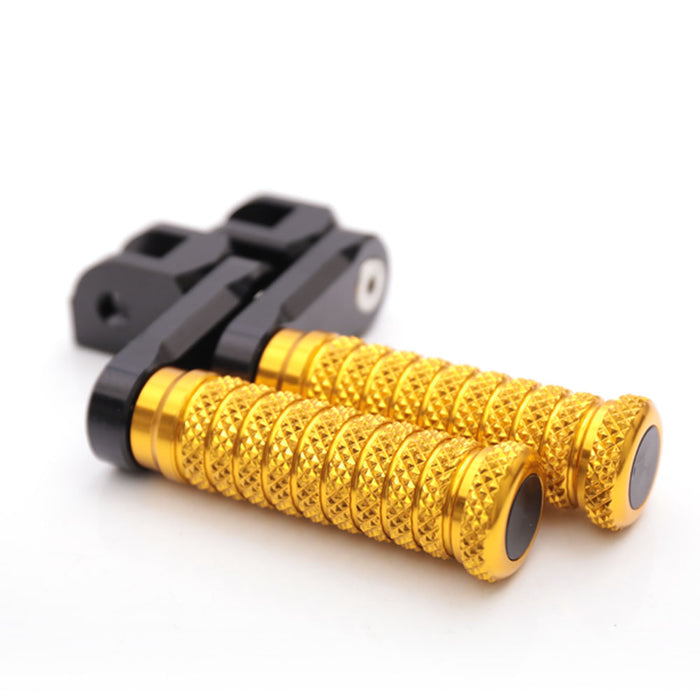 Front view of MC Motoparts 40mm extension foot pegs for Triumph Scrambler Tiger 955i Spring GT motorcycle, showcasing durable metal construction.