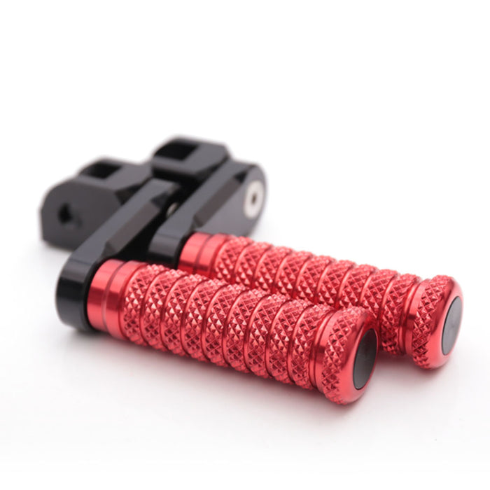 MC Motoparts 40mm extension foot pegs for Triumph Scrambler, Tiger 955i, and Spring GT motorcycles, shown from the front view.