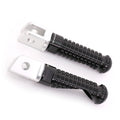 Black MC Motoparts standard foot pegs for Yamaha TDM900, XJR1300, XJ6 motorcycles, shown mounted with metal gripping surfaces.