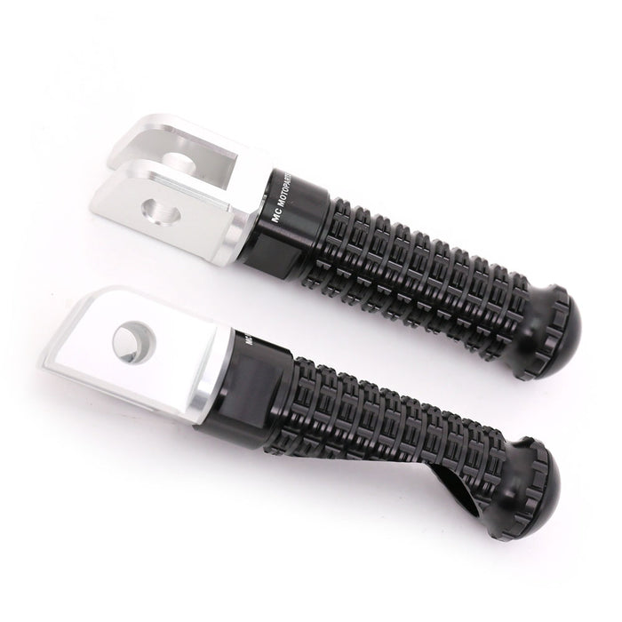 Black MC Motoparts standard foot pegs for Yamaha TDM900, XJR1300, XJ6 motorcycles, shown mounted with metal gripping surfaces.