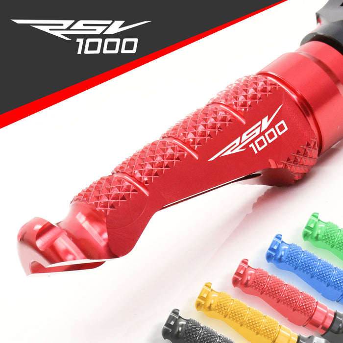 Front MC Motoparts R-FIGHT engraved logo foot pegs for Aprilia RSV1000 R motorcycle, standard style with textured grip surface.