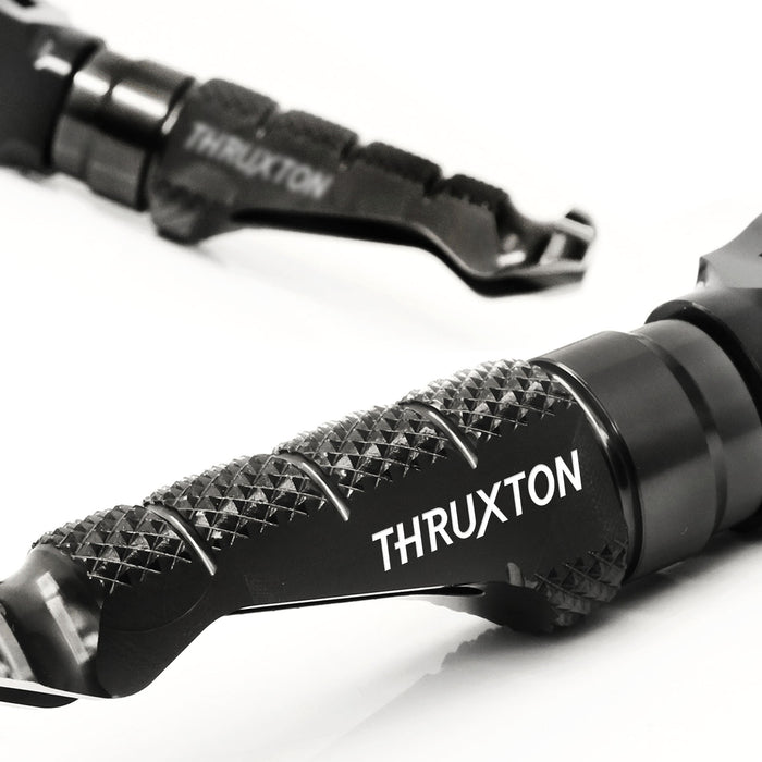 Front R-FIGHT engraved logo foot pegs for Triumph Thruxton R RS 16-20, MC Motoparts standard motorcycle foot pegs.