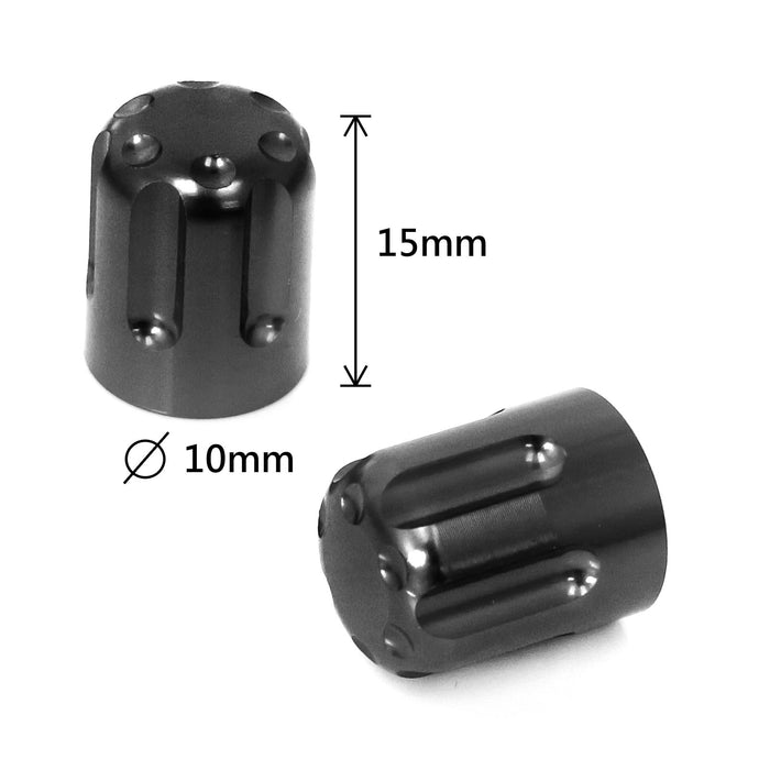 Black motorcycle tire valve stem caps by MC Motoparts, close-up view showing durable metal construction.