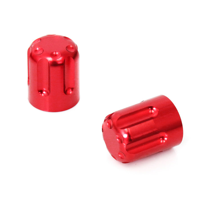 Red motorcycle tire valve stem caps by MC Motoparts with a sleek design, shown on a valve stem for motorcycle wheels.