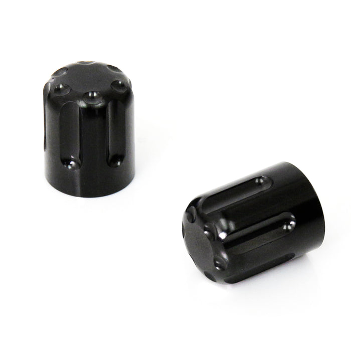 Black motorcycle tire valve stem caps by MC Motoparts, close-up showing durable metal design and threading.