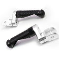 Rear 25mm extension foot pegs for Aprilia RSV1000 Tuono V4R by MC Motoparts, showing black metal foot peg extensions on motorcycle.