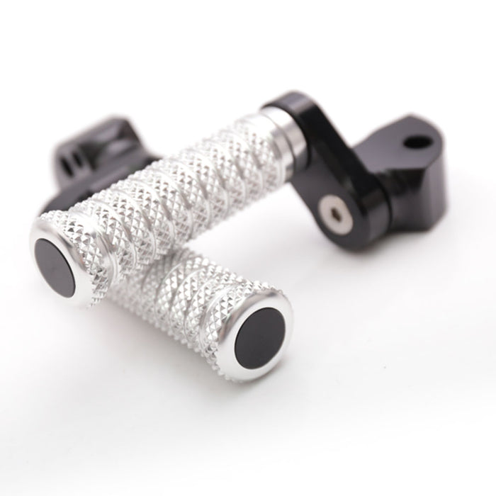 Black 25mm extension foot pegs for Aprilia RSV1000 Tuono V4R, made by MC Motoparts, shown with mounting pole and footrest.