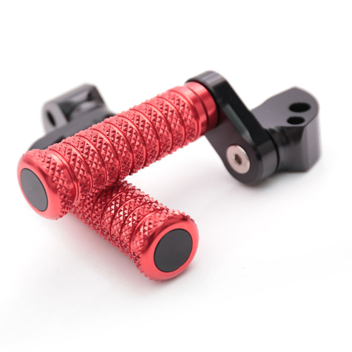 Black 25mm extension foot pegs for Aprilia RSV1000 Tuono V4R motorcycle, made by MC Motoparts, shown with rear mounting.