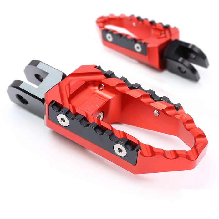 Rear MC Motoparts touring wide foot pegs for Aprilia RSV1000 Tuono V4R TRC motorcycle, black standard foot pegs for enhanced riding comfort.