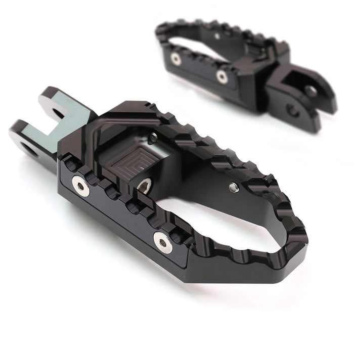 Rear MC Motoparts touring wide foot pegs for Aprilia RSV1000 Tuono V4R TRC motorcycle, standard foot pegs with black finish.