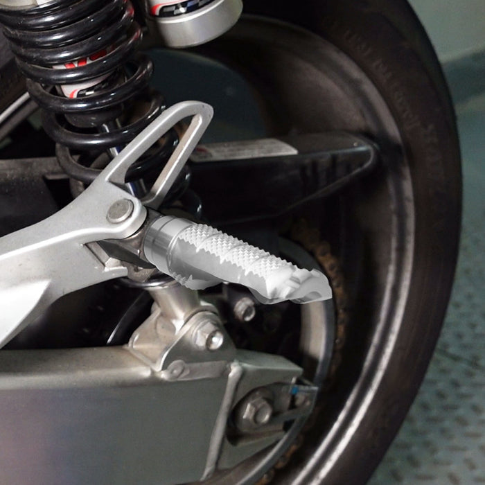 Rear MC Motoparts foot pegs installed on Ducati Supersport 950 Scrambler Nightshift motorcycle.