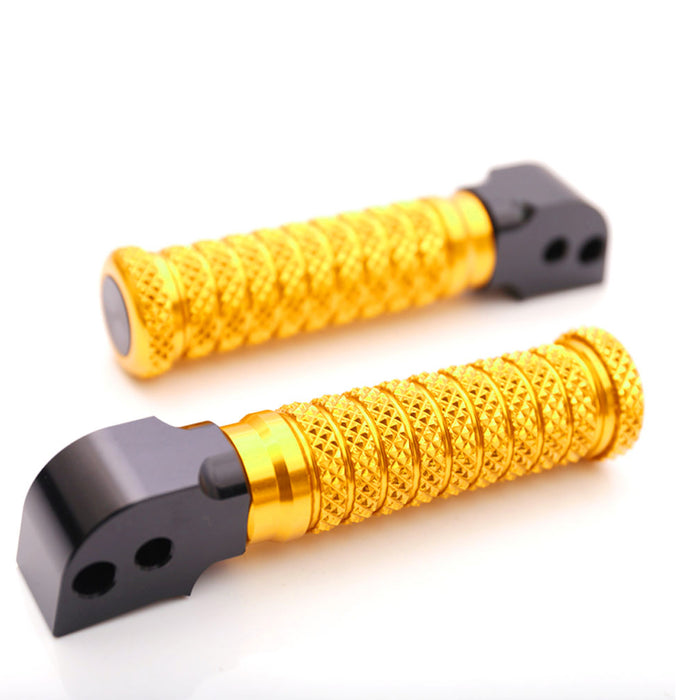 Rear MC Motoparts standard foot pegs for Honda CBR1000RR-R, CB125R, Rebel 500 motorcycle, shown with black and gold design.